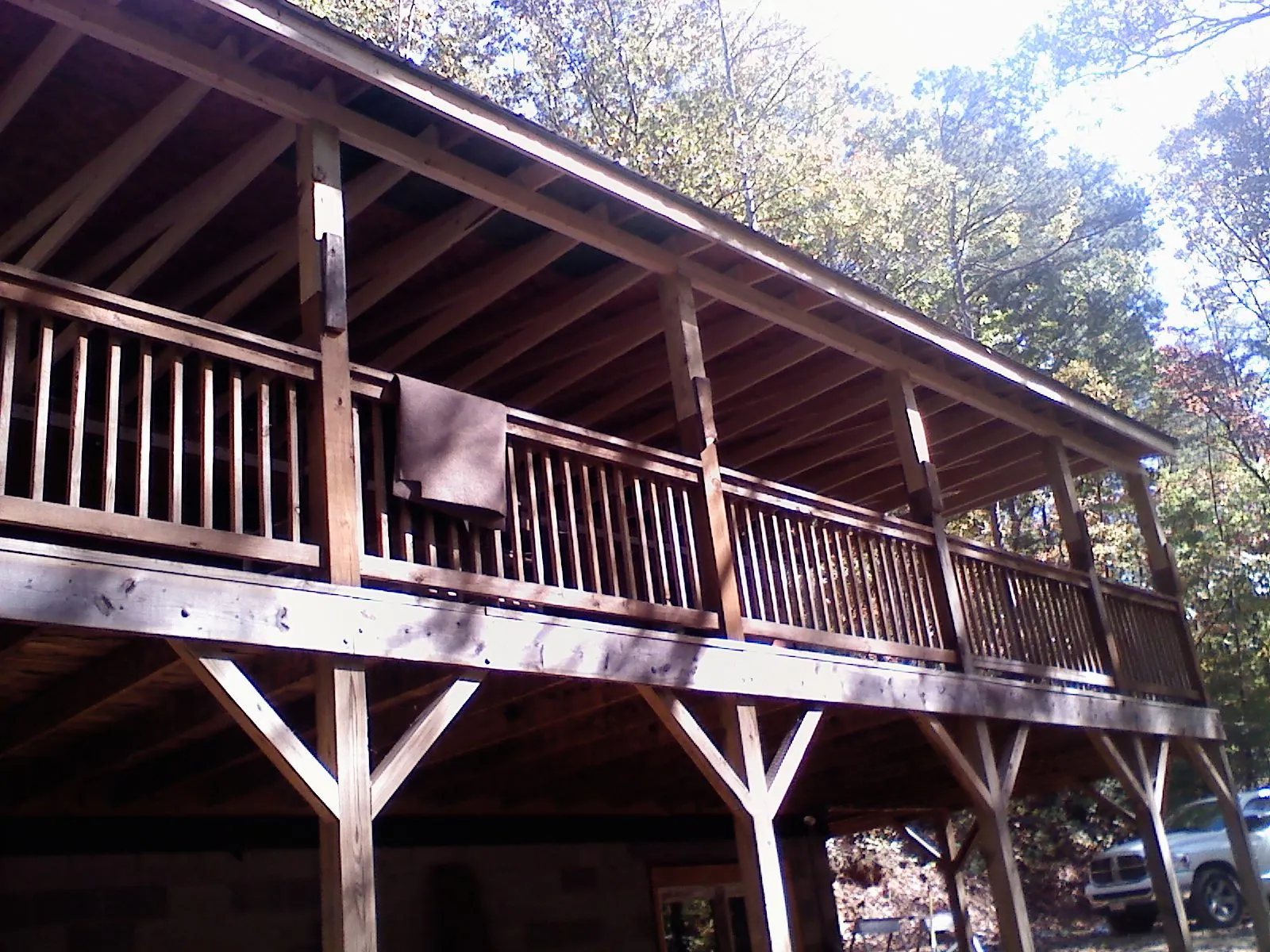 Timber framing under a new elevated porch and deck — Roof Leak Repair in Angelus Oaks by Roofing Brothers